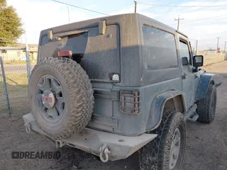 2014 Jeep Wrangler Sport with VIN 1C4AJWAG0EL326774, listed as a IAAI auction lot 41691784 with 98,696 mi miles and . Bid and sale history available at DreamBid. Image 4.