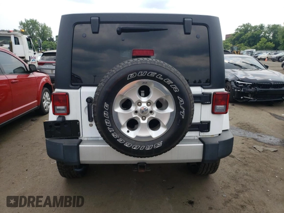 2015 Jeep Wrangler Unlimited Sahara z VIN 1C4BJWEG6FL627890, wystawiony jako Copart lot #58080945 z przebiegiem 145 941 mil mil oraz Szkoda całkowita • Salvage title. Historia ofert i sprzedaży dostępna na DreamBid. Obrazek 6.