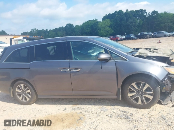 2015 Honda Odyssey Touring Elite with VIN 5FNRL5H95FB127156, listed as a IAAI auction lot 42618059 with 160,074 mi miles and . Bid and sale history available at DreamBid. Image 13.