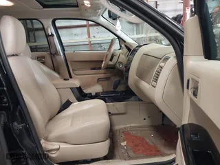 2011 Ford Escape Limited with VIN 1FMCU0EG0BKB30015, listed as a IAAI auction lot 41987953 with 203,057 mi miles. Bid and sale history available at carsss.com. Image 5.