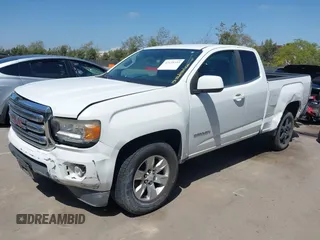 2015 GMC Canyon 2WD SLE z VIN 1GTH5BEA4F1239815, wystawiony jako IAAI lot #42135355 z przebiegiem 110 696 mil mil oraz . Historia ofert i sprzedaży dostępna na DreamBid. Obrazek 2.