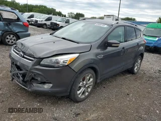 2015 Ford Escape Titanium with VIN 1FMCU9J96FUB32972, listed as a Copart auction lot 62886145 with 215,769 mi miles and Salvage title. Bid and sale history available at DreamBid. Image 1.