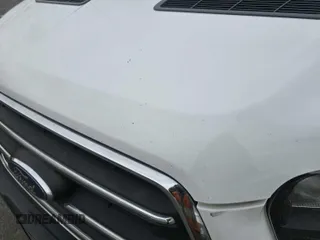 2020 Ford Transit Cargo z VIN 1FTBF4UG0LKB26146, wystawiony jako IAAI lot #42789886 z przebiegiem 137 541 mil mil oraz . Historia ofert i sprzedaży dostępna na DreamBid. Obrazek 21.