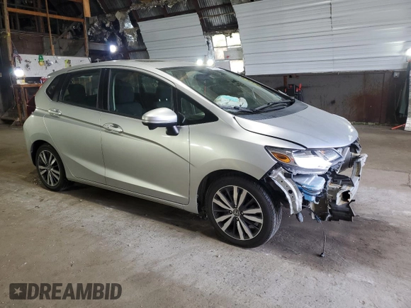 2015 Honda Fit EX-L with VIN 3HGGK5H86FM754172, listed as a Copart auction lot 60870975 with 74,377 mi miles and Salvage title. Bid and sale history available at DreamBid. Image 4.