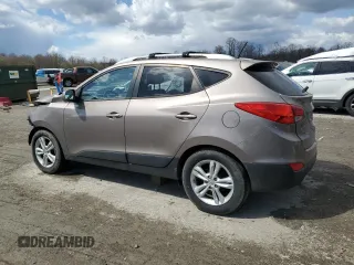 2011 Hyundai Tucson Limited with VIN KM8JUCAC2BU200517, listed as a Copart auction lot 53252005 with 158,502 mi miles and Salvage Title. Bid and sale history available at DreamBid. Image 2.