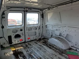 2012 Ford Econoline Cargo Commercial with VIN 1FTNE2EL0CDB33215, listed as a Copart auction lot 63120784 with 258,466 mi miles and Salvage title. Bid and sale history available at DreamBid. Image 11.