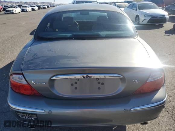2003 Jaguar S-Type z VIN SAJEA01U03HM57757, wystawiony jako Copart lot #73440434 z przebiegiem 188 389 mil mil oraz Szkoda całkowita • Salvage title. Historia ofert i sprzedaży dostępna na DreamBid. Obrazek 6.