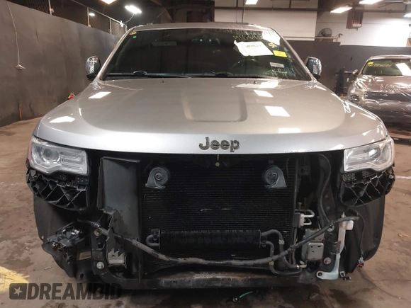 2015 Jeep Grand Cherokee Overland with VIN 1C4RJFCG1FC215426, listed as a IAAI auction lot 41689821 with 128,563 mi miles. Bid and sale history available at carsss.com. Image 13.
