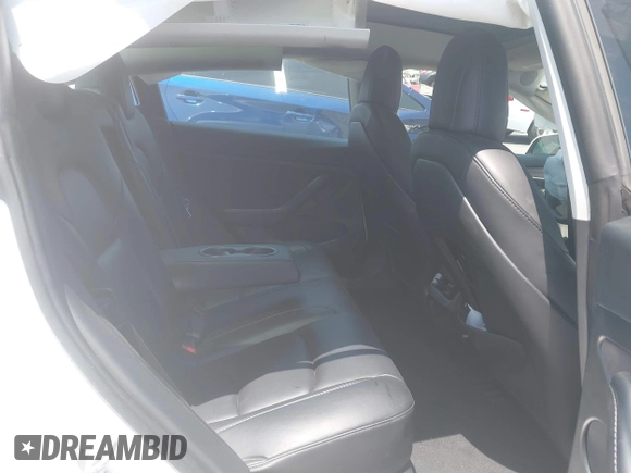 2023 Tesla Model 3 with VIN 5YJ3E1EA6PF460054, listed as a IAAI auction lot 41231368 with 29,437 mi miles and . Bid and sale history available at DreamBid. Image 8.