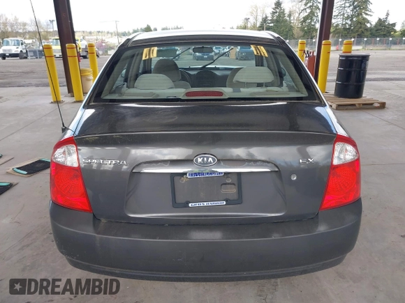 2004 Kia Spectra LX with VIN KNAFE121145031237, listed as a IAAI auction lot 41954550 with 133,744 mi miles. Bid and sale history available at carsss.com. Image 16.
