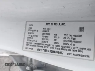 2021 Tesla Model 3 Long Range with VIN 5YJ3E1EB6MF878957, listed as a IAAI auction lot 41915482 with 59,578 mi miles. Bid and sale history available at carsss.com. Image 9.