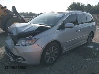 2014 Honda Odyssey Touring with VIN 5FNRL5H95EB108427, listed as a IAAI auction lot 39992643 with 100,658 mi miles and . Bid and sale history available at DreamBid. Image 17.