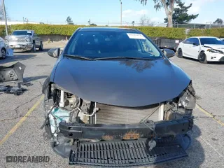 2019 Toyota Corolla L with VIN 5YFBURHEXKP922883, listed as a IAAI auction lot 41702924 with 99,166 mi miles. Bid and sale history available at carsss.com. Image 6.