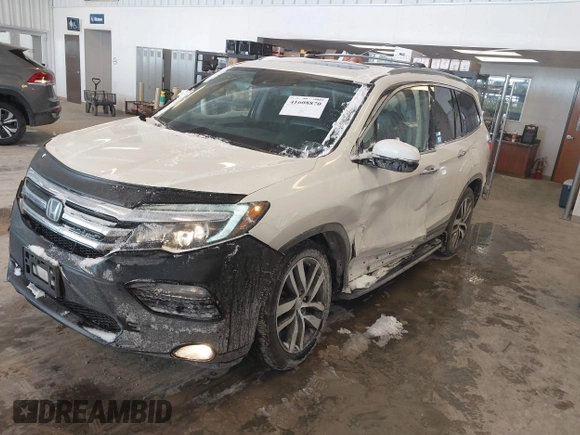 2017 Honda Pilot Touring with VIN 5FNYF6H92HB032873, listed as a IAAI auction lot 41608870 with 123,888 mi miles. Bid and sale history available at carsss.com. Image 2.