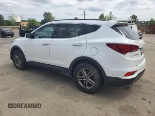 2018 Hyundai Santa Fe 2.4L z VIN 5NMZUDLB9JH095157, wystawiony jako Copart lot #53546725 z przebiegiem 128 840 mil mil oraz Szkoda całkowita • Salvage title. Historia ofert i sprzedaży dostępna na DreamBid. Obrazek 2.