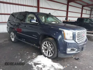2018 GMC Yukon Denali with VIN 1GKS2CKJ5JR335718, listed as a IAAI auction lot 40991126 with 87,479 mi miles. Bid and sale history available at carsss.com. Image 1.