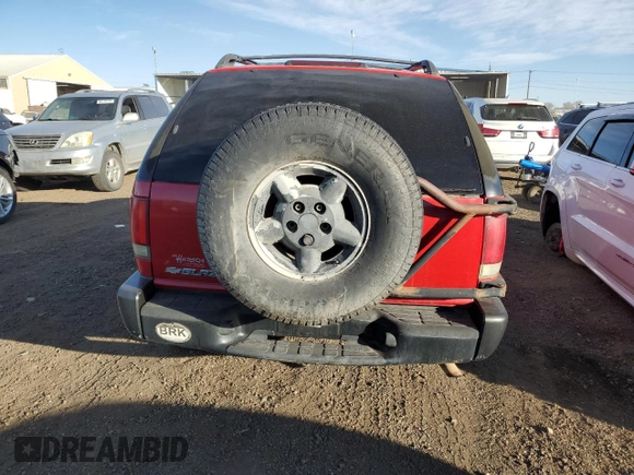2004 Chevrolet Blazer LS z VIN 1GNCT18X34K141674, wystawiony jako Copart lot #85500954 z przebiegiem Nie podano mil oraz Czysty tytuł • Clean title. Historia ofert i sprzedaży dostępna na DreamBid. Obrazek 6.