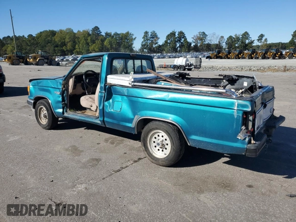 1992 Ford Ranger with VIN 1FTCR10A3NTA81065, listed as a Copart auction lot 74002434 with 9,827 mi miles and Salvage Title. Bid and sale history available at carsss.com. Image 2.