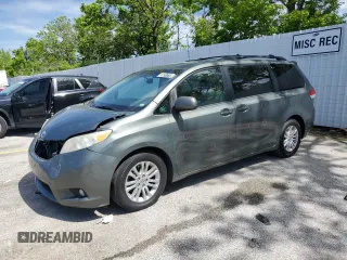 2014 Toyota Sienna XLE with VIN 5TDYK3DC1ES453924, listed as a Copart auction lot 56148565 with 198,185 mi miles and Clean title. Bid and sale history available at DreamBid. Image 1.
