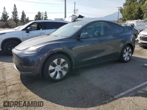 2024 Tesla Model Y Long Range z VIN 7SAYGAEE0RF021084, wystawiony jako Copart lot #51973285 z przebiegiem 25 990 mil mil oraz Szkoda całkowita • Salvage title. Historia ofert i sprzedaży dostępna na DreamBid. Obrazek 1.