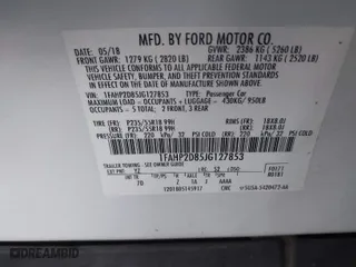 2018 Ford Taurus SE with VIN 1FAHP2D85JG127853, listed as a IAAI auction lot 41596548 with 128,087 mi miles. Bid and sale history available at carsss.com. Image 9.