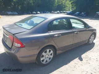 2010 Honda Civic Sdn LX with VIN 2HGFA1F57AH587327, listed as a IAAI auction lot 40209466 with 121,228 mi miles. Bid and sale history available at carsss.com. Image 4.