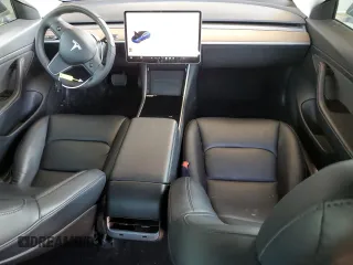 2020 Tesla Model 3 Standard Range Plus with VIN 5YJ3E1EA7LF705907, listed as a Copart auction lot 48765145 with 104,479 mi miles and Salvage Title. Bid and sale history available at DreamBid. Image 8.