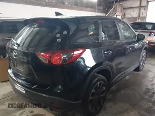 2016 Mazda CX-5 Grand Touring with VIN JM3KE4DY5G0816575, listed as a IAAI auction lot 42101340 with 180,762 mi miles and . Bid and sale history available at carsss.com. Image 4.