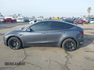 2023 Tesla Model Y Long Range with VIN 7SAYGDEE7PA196038, listed as a IAAI auction lot 41459601 with 16,489 mi miles and . Bid and sale history available at DreamBid. Image 14.