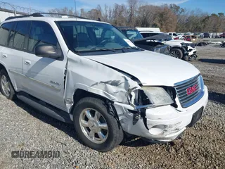 2006 GMC Envoy SLT with VIN 1GKDS13S062128531, listed as a IAAI auction lot 41458983 with 119,385 mi miles. Bid and sale history available at carsss.com. Image 6.