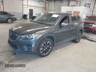 2016 Mazda CX-5 Grand Touring with VIN JM3KE2DYXG0846787, listed as a IAAI auction lot 41346364 with 113,553 mi miles. Bid and sale history available at carsss.com. Image 2.