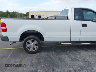2005 Ford F-150 XL with VIN 1FTRF14W35NB42167, listed as a IAAI auction lot 41990938 with 256,964 mi miles. Bid and sale history available at carsss.com. Image 6.