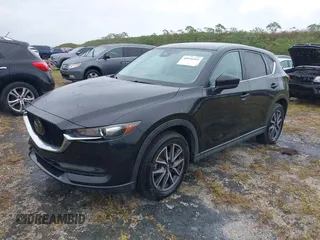 2018 Mazda CX-5 Touring with VIN JM3KFACM0J0315739, listed as a IAAI auction lot 40516262 with 60,727 mi miles. Bid and sale history available at carsss.com. Image 17.