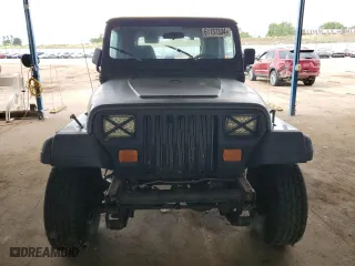 1995 Jeep Wrangler Sahara with VIN 1J4FY49S1SP256179, listed as a Copart auction lot 61137334 with 187,391 mi miles and Salvage Title. Bid and sale history available at carsss.com. Image 5.