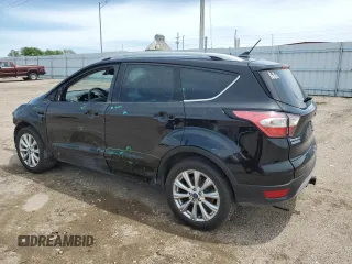 2018 Ford Escape Titanium with VIN 1FMCU9J95JUB31286, listed as a Copart auction lot 58721355 with 100,329 mi miles and Salvage title. Bid and sale history available at DreamBid. Image 2.