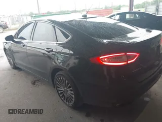 2014 Ford Fusion Titanium with VIN 3FA6P0K99ER235785, listed as a IAAI auction lot 41946638 with 212,939 mi miles and . Bid and sale history available at DreamBid. Image 3.