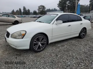 2002 Infiniti Q45 z VIN JNKBF01AX2M007224, wystawiony jako Copart lot #75539244 z przebiegiem 225 024 mil mil oraz Tytuł czysty. Historia ofert i sprzedaży dostępna na DreamBid. Obrazek 1.