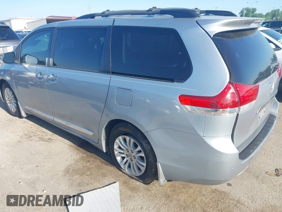 2014 Toyota Sienna XLE with VIN 5TDYK3DC8ES423450, listed as a IAAI auction lot 41972128 with 145,374 mi miles. Bid and sale history available at carsss.com. Image 3.