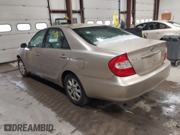 2003 Toyota Camry LE with VIN 4T1BE32K73U136399, listed as a IAAI auction lot 41877554 with 235,078 mi miles and . Bid and sale history available at DreamBid. Image 3.