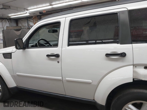 2007 Dodge Nitro SLT with VIN 1D8GU58K97W583408, listed as a IAAI auction lot 41653696 with 124,449 mi miles. Bid and sale history available at carsss.com. Image 14.