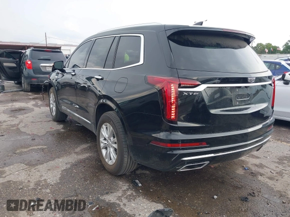 2023 Cadillac XT6 FWD Luxury z VIN 1GYKPAR43PZ147512, wystawiony jako IAAI lot #42175720 z przebiegiem 31 520 mil mil oraz . Historia ofert i sprzedaży dostępna na DreamBid. Obrazek 3.