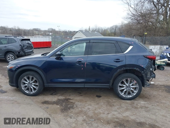 2021 Mazda CX-5 Grand Touring with VIN JM3KFADM0M1321375, listed as a IAAI auction lot 41913449 with 88,178 mi miles. Bid and sale history available at carsss.com. Image 15.