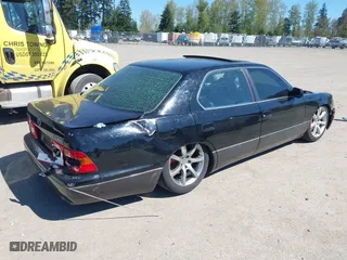 2000 Lexus LS 400 with VIN JT8BH28F8Y0168386, listed as a IAAI auction lot 42063155 with 1 mi miles. Bid and sale history available at carsss.com. Image 4.