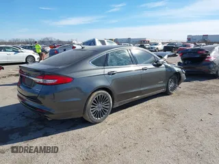 2017 Ford Fusion Hybrid Titanium z VIN 3FA6P0RU0HR314681, wystawiony jako IAAI lot #41288256 z przebiegiem 174 027 mil mil oraz . Historia ofert i sprzedaży dostępna na DreamBid. Obrazek 4.