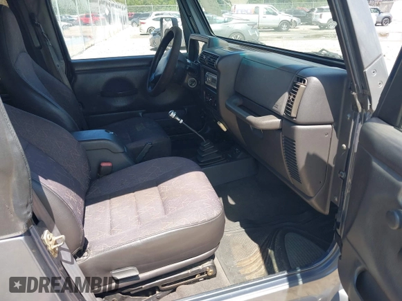 2002 Jeep Wrangler Sport z VIN 1J4FA49S62P731507, wystawiony jako IAAI lot #42584222 z przebiegiem 206 661 mil mil oraz . Historia ofert i sprzedaży dostępna na DreamBid. Obrazek 5.