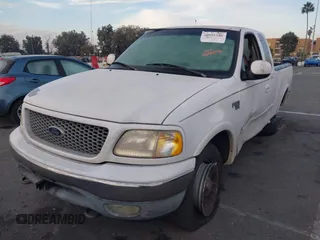 1999 Ford F-150 XL with VIN 1FTRX18L1XKB61205, listed as a IAAI auction lot 40991236 with 178,889 mi miles. Bid and sale history available at carsss.com. Image 17.