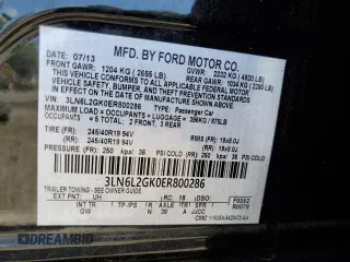 2014 Lincoln MKZ z VIN 3LN6L2GK0ER800286, wystawiony jako Copart lot #57644645 z przebiegiem 130 880 mil mil oraz Szkoda całkowita • Salvage title. Historia ofert i sprzedaży dostępna na DreamBid. Obrazek 13.