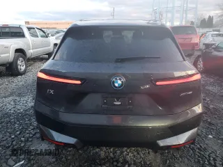 2022 BMW iX xDrive50 with VIN WB523CF05NCK62929, listed as a Copart auction lot 83295544 with 24,299 mi miles and Salvage Title. Bid and sale history available at carsss.com. Image 6.