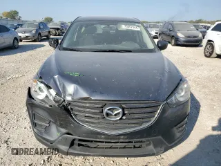 2016 Mazda CX-5 Sport with VIN JM3KE2BE7G0739544, listed as a Copart auction lot 75557244 with 128,336 mi miles and Salvage Title. Bid and sale history available at DreamBid. Image 5.