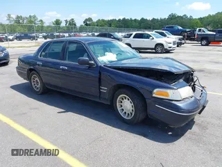 1999 Ford Crown Victoria z VIN 2FAFP73W4XX203490, wystawiony jako IAAI lot #42295045 z przebiegiem 204 841 mil mil oraz . Historia ofert i sprzedaży dostępna na DreamBid. Obrazek 1.